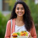 University student holding healthy lunch